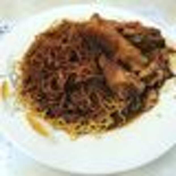 Saucy Cantonese noodles flattened with the help of a bamboo pole.