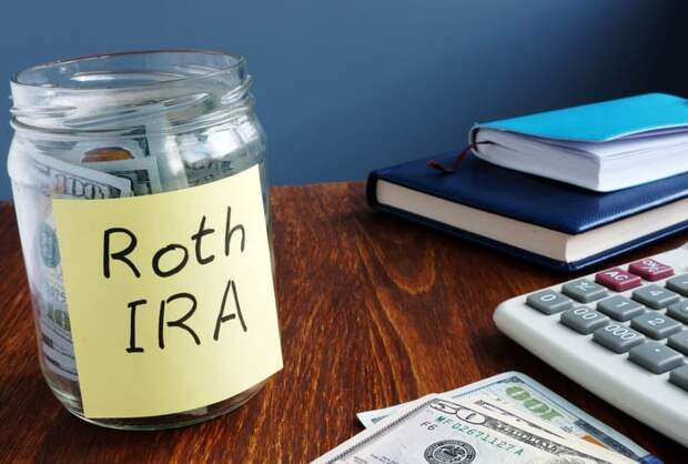 A jar marked Roth IRA stuffed with money.