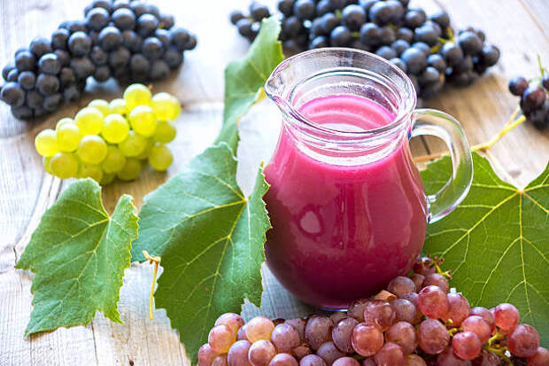 Fresh grape juice on wood background 2809186 Stock Photo at Vecteezy