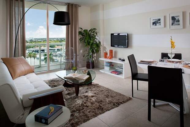 modern open living area with striped accent wall