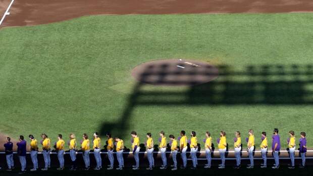 The LSU baseball stands for the national anthem before a game.