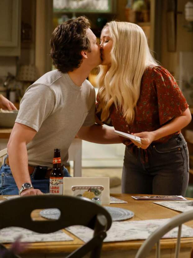 Georgie and Mandy kiss while Jim looks away on Georgie & Mandy's First Marriage Season 1 Episode 18