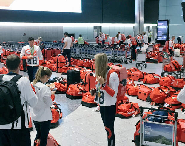 british-olympic-athletes-red-bags-heathrow-airport-5