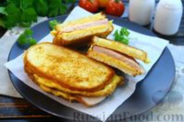 Фото к рецепту: Горячие бутерброды с яйцом, ветчиной и сыром (на сковороде)