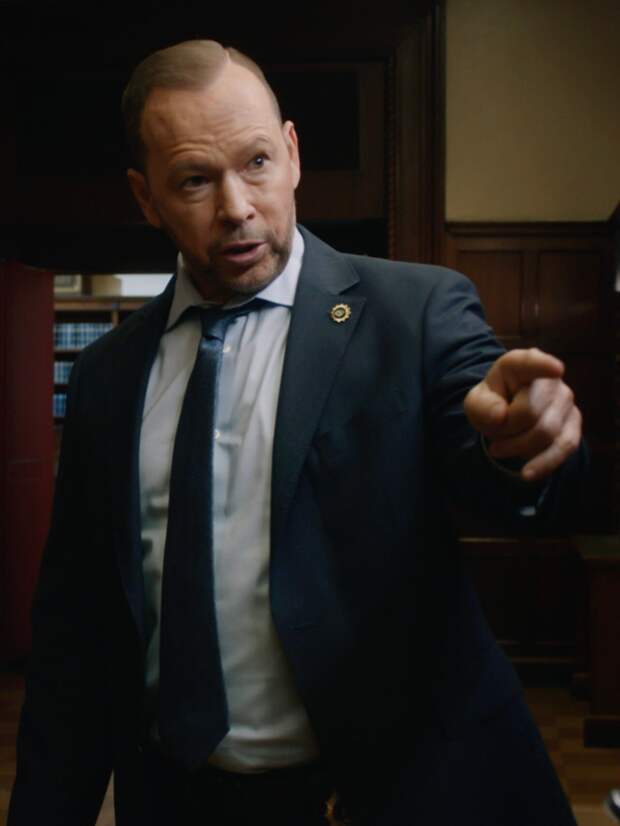 Danny pointing at someone while Baez looks smug on Blue Bloods Season 14 Episode 17