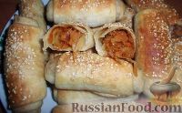 Фото к рецепту: Слоеные пирожки с капустой
