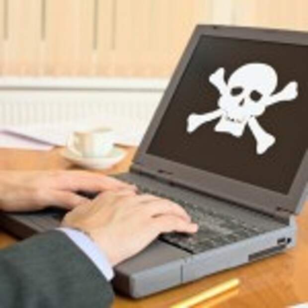 The gray laptop with the pirate software