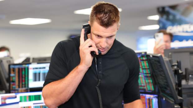 Rob Gronkowski answers a phone for a charity event.