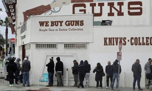 People wait in line outside the Martin B Retting gun store in Culver City on 15 March. 