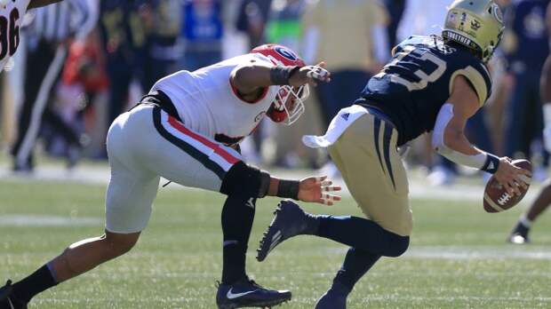 Jordan Yates scrambles from the defense.