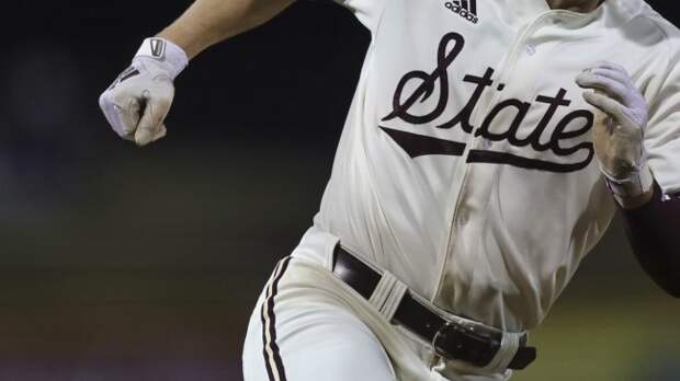 A Mississippi State baserunner scores a run.