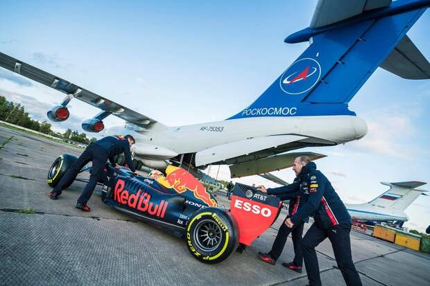 Packing Aston Martin Red Bull Racing’s F1 car onto a plane ahead of the Zero-G pitstop aboard an aircraft in Russia.