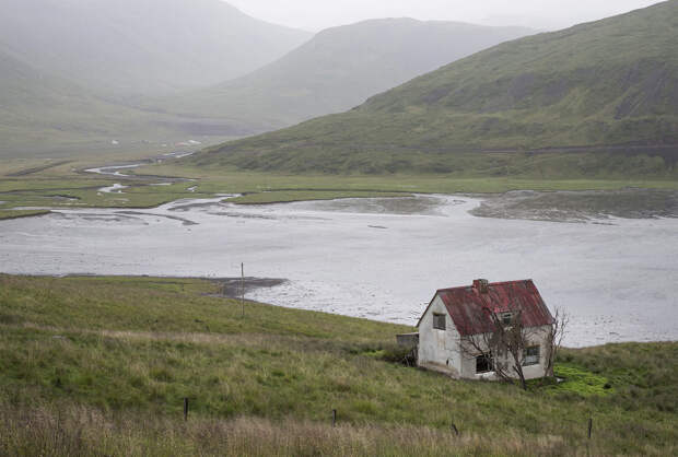 An abandoned cottage by an inlet in Iceland's Westfjords.