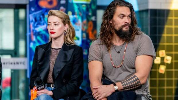 ambe heard and jason momoa looking uncomfortable