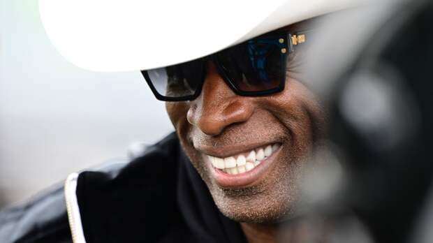 Coach Deion Sanders smiling 