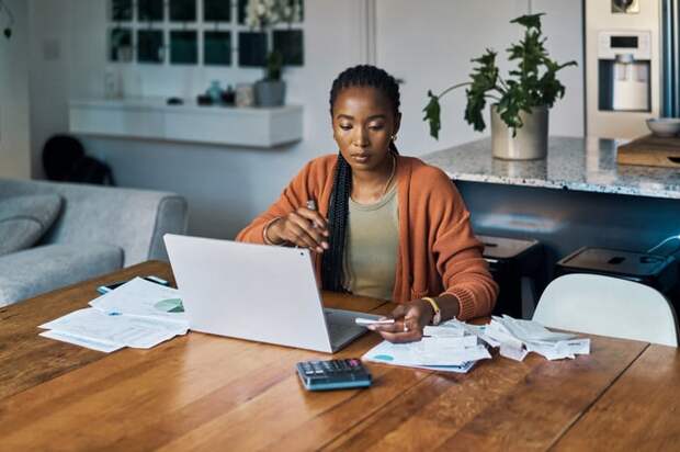 Person calculating their budget personal finance.