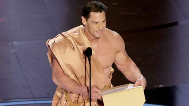 john cena on stage at the oscars