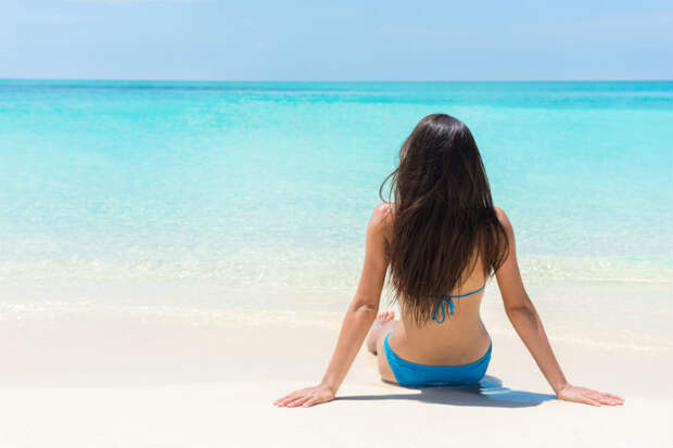 bigstock-Beach-relaxation-bikini-suntan-126143948