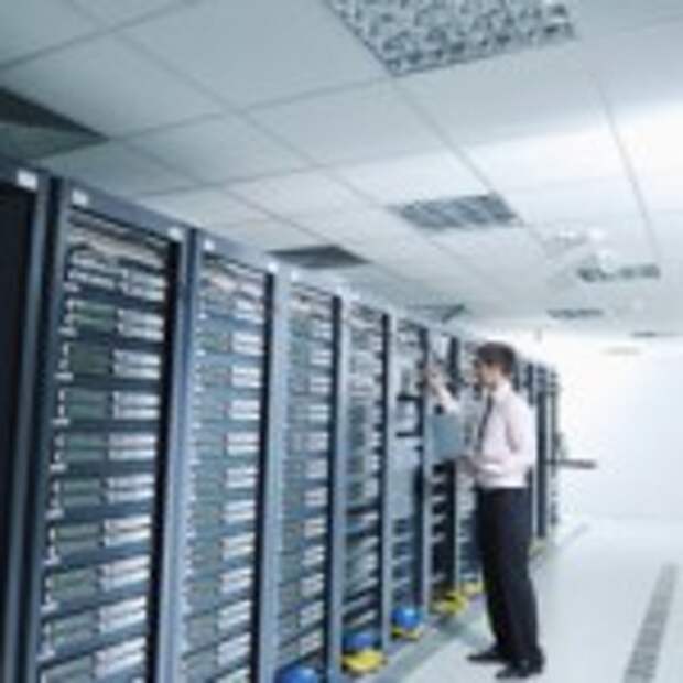 Young handsome business man engeneer in datacenter server room