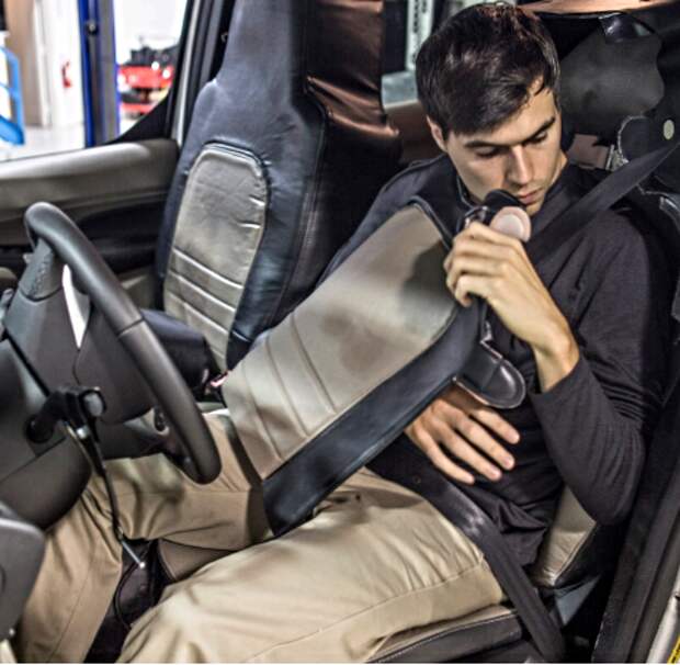 That's not a car seat, that's a man!