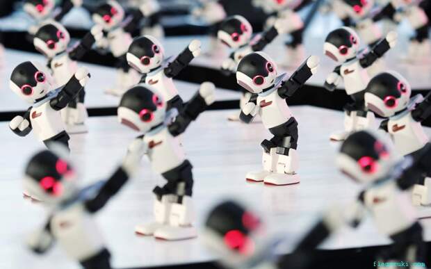 Сто человекоподобных роботов «Robi» исполнили синхронный танец во время промо-акции для еженедельного журнала «Robi» в Токио.