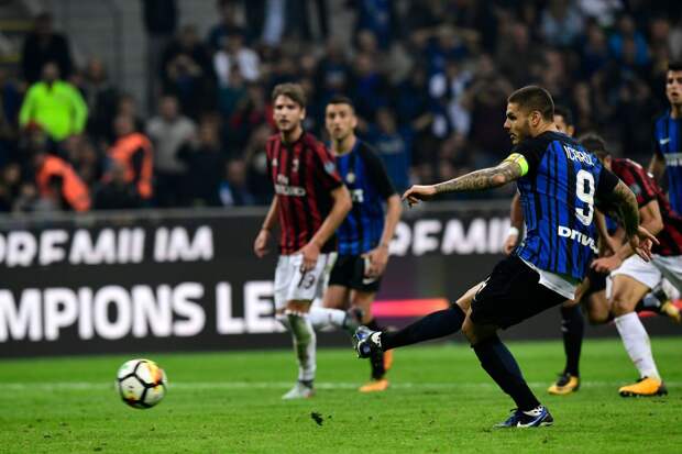 Inter Milan's Captain Argentinian forward Mauro Icardi kicks and score a penalty during the Italian Serie A football match Inter Milan Vs AC Milan on October 15, 2017 at the 'San Siro Stadium' in Milan.