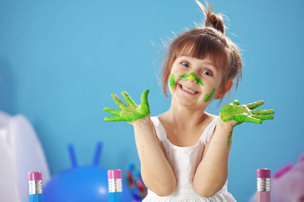 Child painting in the kindergarten