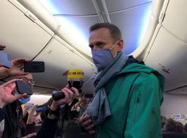 Russian opposition leader Alexei Navalny is seen on board a plane before the departure for the Russian capital Moscow at an airport in Berlin, Germany January 17, 2021. REUTERS/Polina Ivanova