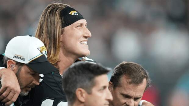 Jacksonville Jaguars quarterback Trevor Lawrence helped off the field