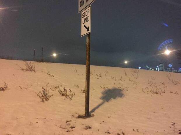 The Light Makes This Sign's Shadow Look Pixelated