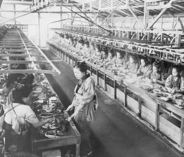 A Japanese silk factory in 1905. Work in progress larvae cocoons are being boiled and silk reeled onto spools