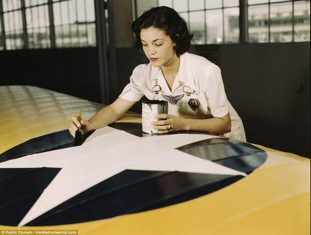 Painting the American insignia on airplane wings is a job that Mrs. Irma Lee McElroy, a former office worker, does with precision and patriotic zeal. Mrs. McElroy is a civil service employee at the naval Air Base, Corpus Christi, Texas. Her husband is a flight instructor
