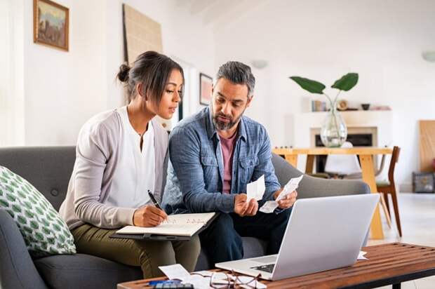 A couple looking at financial paperwork. 