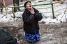 A Ukrainian woman begs Ukrainian President Petro Poroshenko to stop the bombing in Donetsk after shell hit the residential area where she lives, killing two civilians in Donetsk's Kyibishevsky district, on January 29, 2015. Ukrainian President Petro Poroshenko on January 29 called for urgent truce talks with pro-Russian rebels to end a bloody surge in fighting. Poroshenko said the new meeting in the Belarussian capital should lead to "an immediate ceasefire and the withdrawal of heavy weapons from the line of contact." AFP PHOTO / MANU BRABO