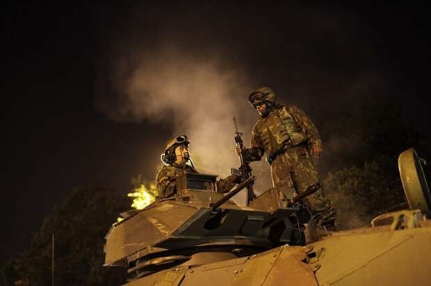 Brazilian Navy soldiers in an armoured vehicle prepare for an operation against drug dealers at Mangueira slum in Rio de Janeiro