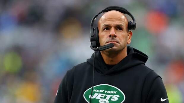 new york jets head coach robert saleh wearing a black hoodie