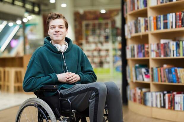 Smiling person in. a wheelchair.