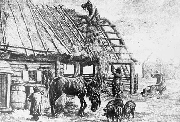Крестьяне сбрасывают с крыши солому для корма скота