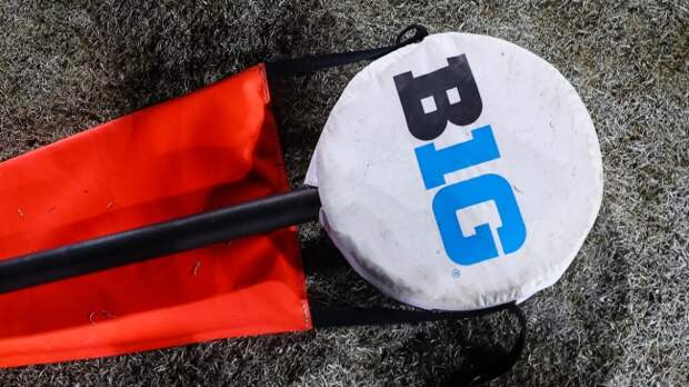 A Big Ten logo on a first down marker.