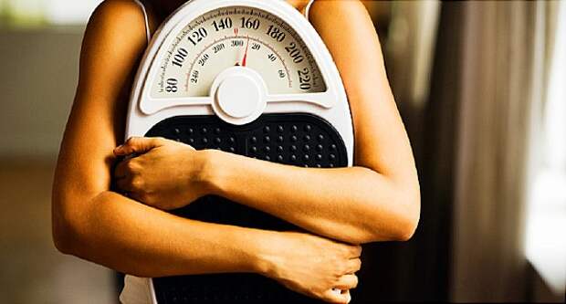 woman holding scale