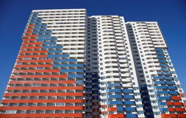 A general view shows a new apartment block with a facade, depicting the colours of the Russian state flag, in Saint Petersburg, Russia March 24, 2019. REUTERS/Anton Vaganov