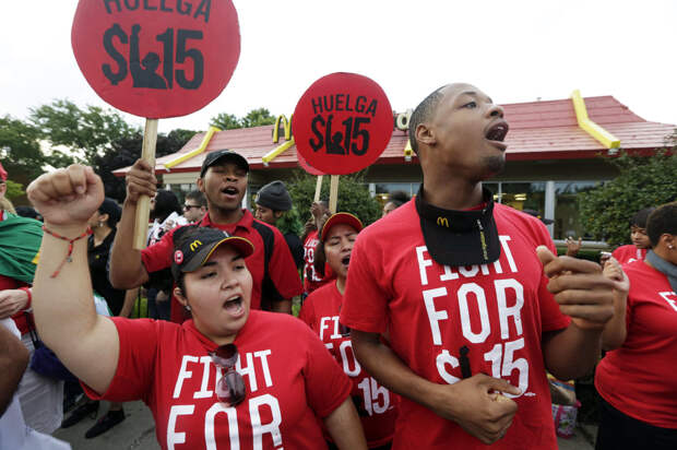Protesters demonstrate outside a McDonald's in Chicago. Hundreds of workers from McDonald's, Taco Bell, Wendy's and other fast-food chains were expected to walk off their jobs Thursday to push the companies to pay their employees at least $15 an hour, according to labor organizers.