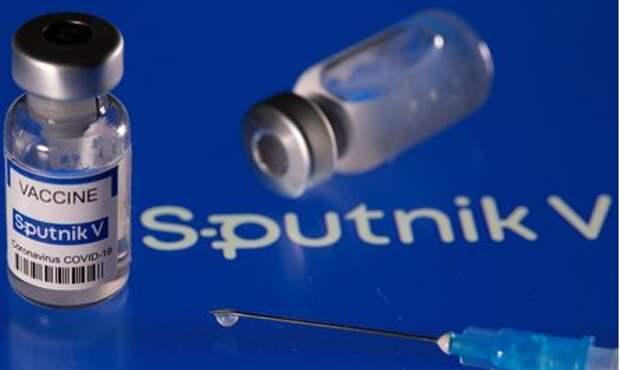 Vial labelled "Sputnik V coronavirus disease (COVID-19) vaccine" placed on displayed Sputnik V logo is seen in this illustration picture taken March 24, 2021. REUTERS/Dado Ruvic/Illustration