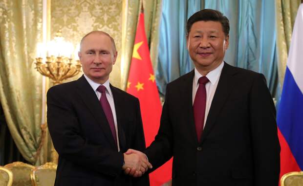 Шольц: Германия будет следить за визитом Путина в Китай