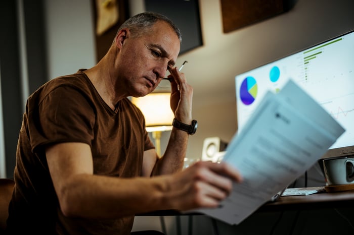 Serious person looking at documents.