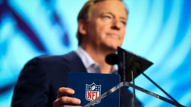 Roger Goodell with NFL logo
