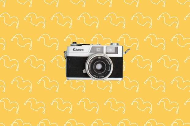 A camera against a yellow background.