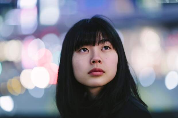 A person looking up with a serious expression.