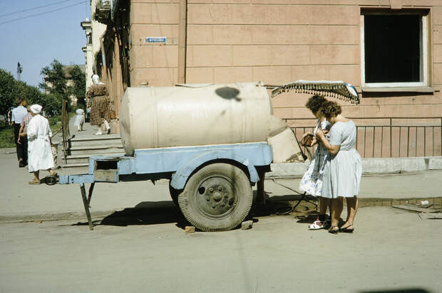 Russia, women making purchase from milk truck. Siberia Russia, women making purchase from milk truck. Siberia