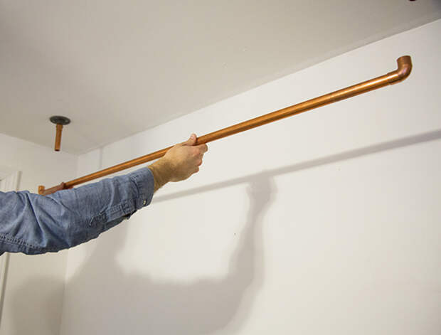 Hanging Copper Pipe Clothing Rack DIY (click through for tutorial)       